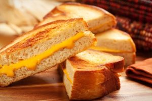 A grilled cheese sandwich divided into four mini sandwiches.