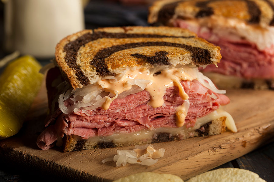 A perfectly made Reuben sandwich on a wooden platter at a local restaurant in Springfield, IL that was created in the early 1900s.